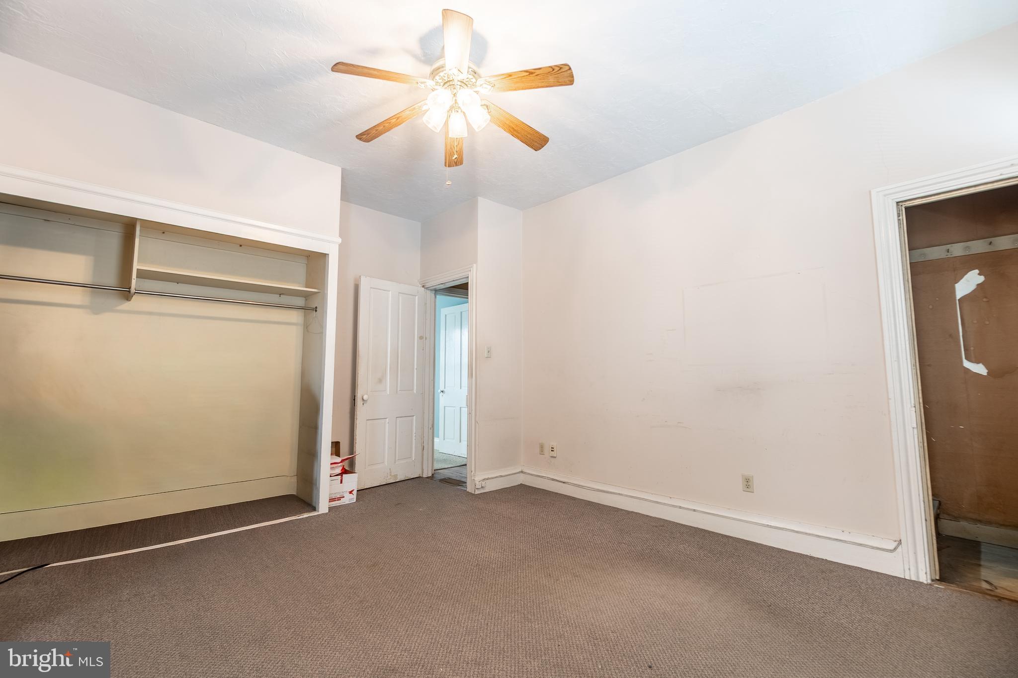 249 York Street Hanover, PA 17331 - Photo 25 of 42 an empty room with windows and fan