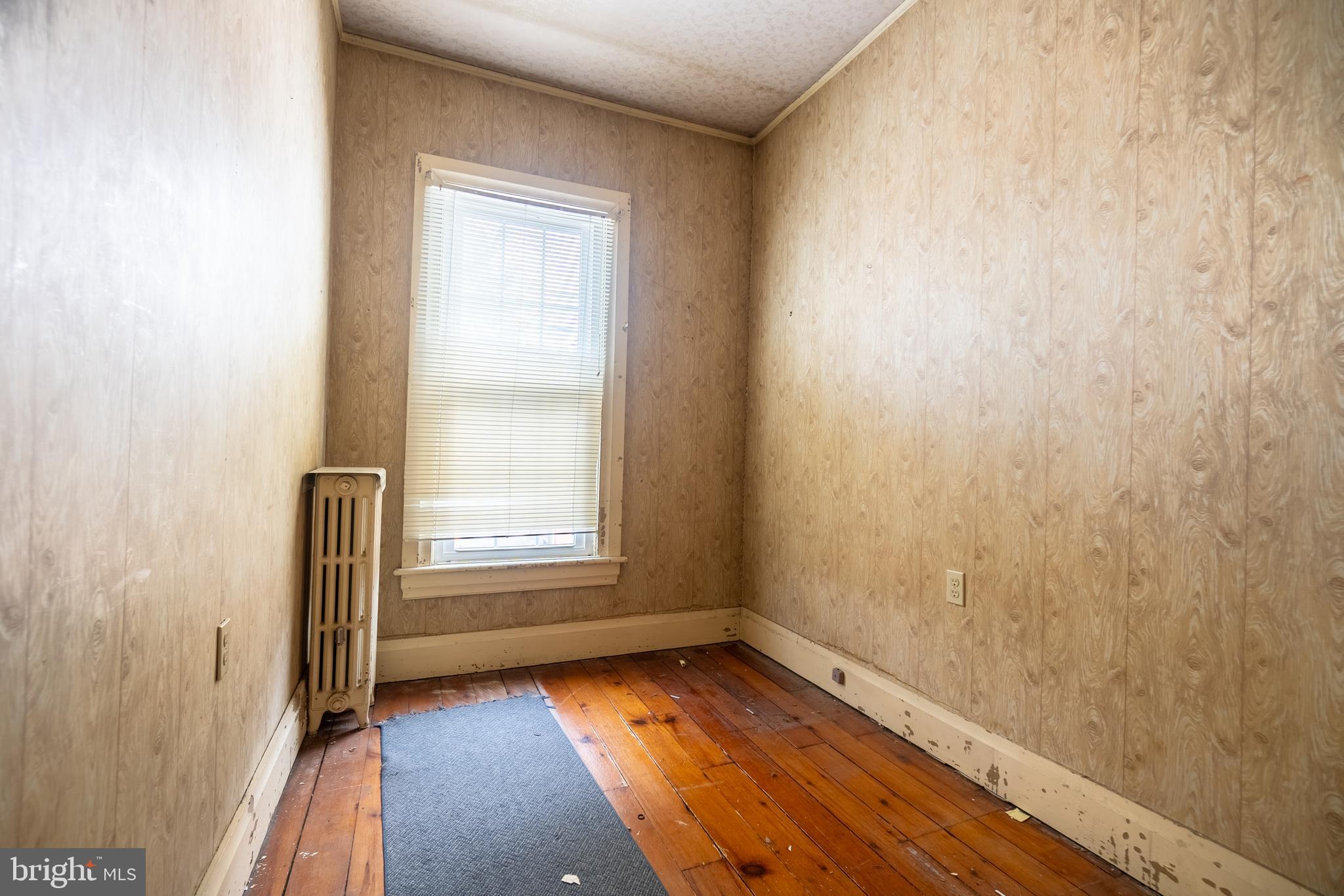249 York Street Hanover, PA 17331 - Photo 33 of 42 a view of an empty room with wooden floor and a window