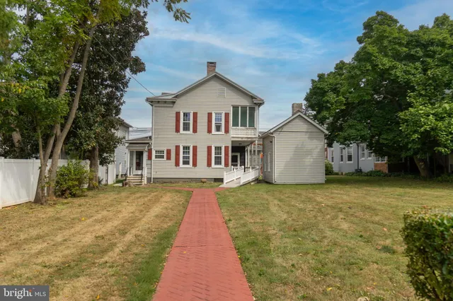 a aerial view of a house with a yard