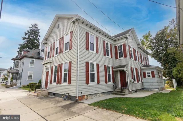 front view of of house with a yard