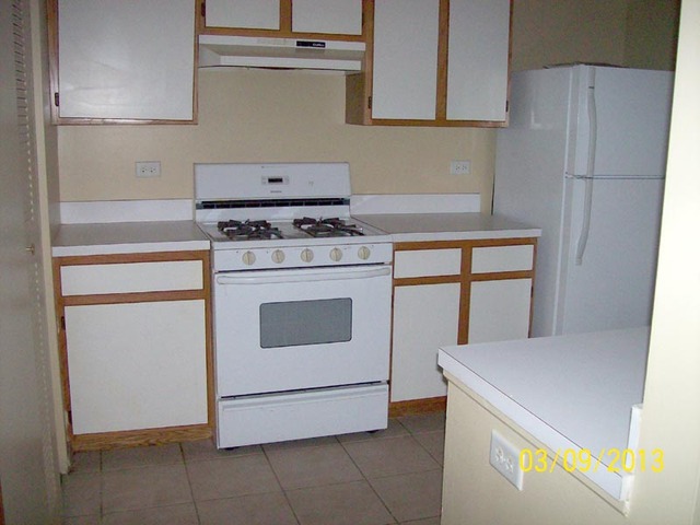 1402 Normantown Road Naperville, IL 60564 - Photo 4 of 11 a kitchen with a stove and a refrigerator