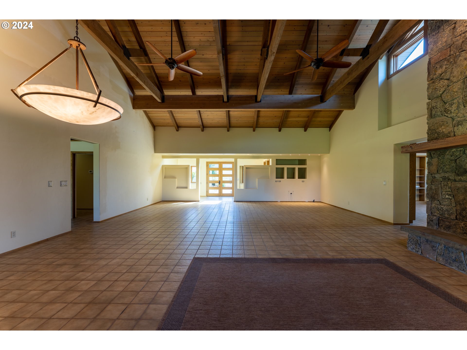 1488 Red Hill Road Oakland, OR 97462 - Photo 7 of 35 a view of an empty room with wooden floor and a window