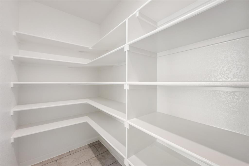 3665 Jordan Way Kaufman, TX 75142 - Photo 13 of 34 a view of walk in closet with empty racks