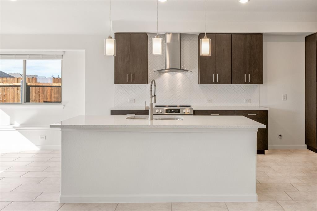 3665 Jordan Way Kaufman, TX 75142 - Photo 15 of 34 a kitchen with a sink and a refrigerator