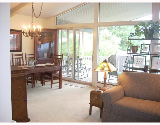 110 Youkers Road Butler, PA 16001 - Photo 2 of 14 Den/Family/Great Room. Great room is 21X17 with wall to ceiling glass, cathedral ceiling that overlooks 9 acres and lake. Wrap around covered deck to enjoy 3 seasons.