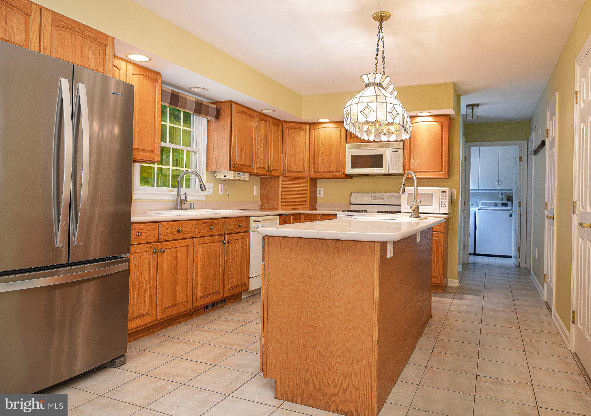 711 Gilbert Road Aberdeen, MD 21001 - Photo 5 of 54 a kitchen with stainless steel appliances granite countertop a sink stove and refrigerator