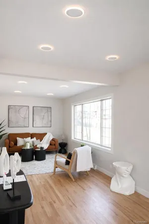 a living room with furniture and a window