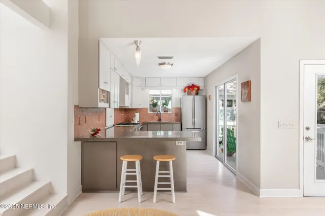 a spacious bedroom with a large bed and a large window