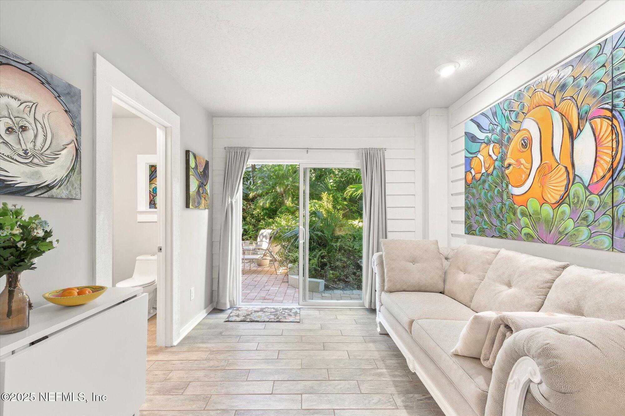 1685 Santander Street St. Augustine, FL 32080 - Photo 22 of 48 a living room with furniture and a potted plant