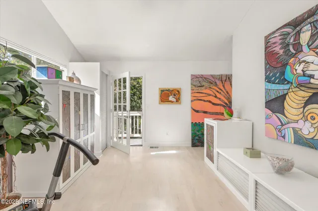 a bedroom with furniture and a window