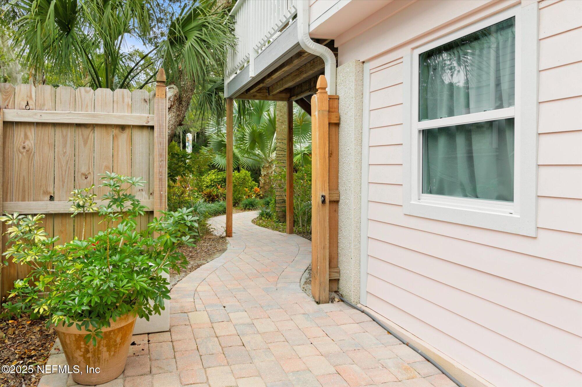 1685 Santander Street St. Augustine, FL 32080 - Photo 38 of 48 a couple of potted plants in front of door