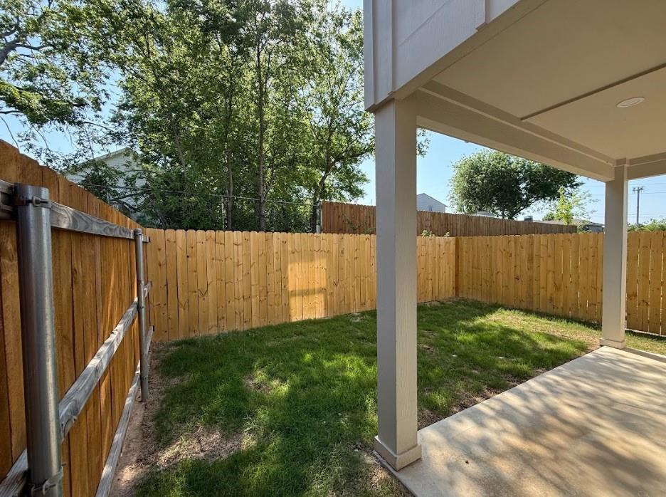 6702 South Lancaster Road Dallas, TX 75241 - Photo 20 of 20 Covered patio with a concrete surface, enclosed by a wood privacy fence