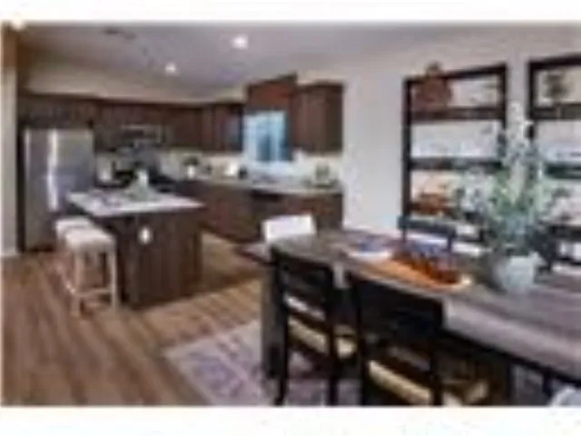 a kitchen with kitchen island granite countertop wooden cabinets and counter space