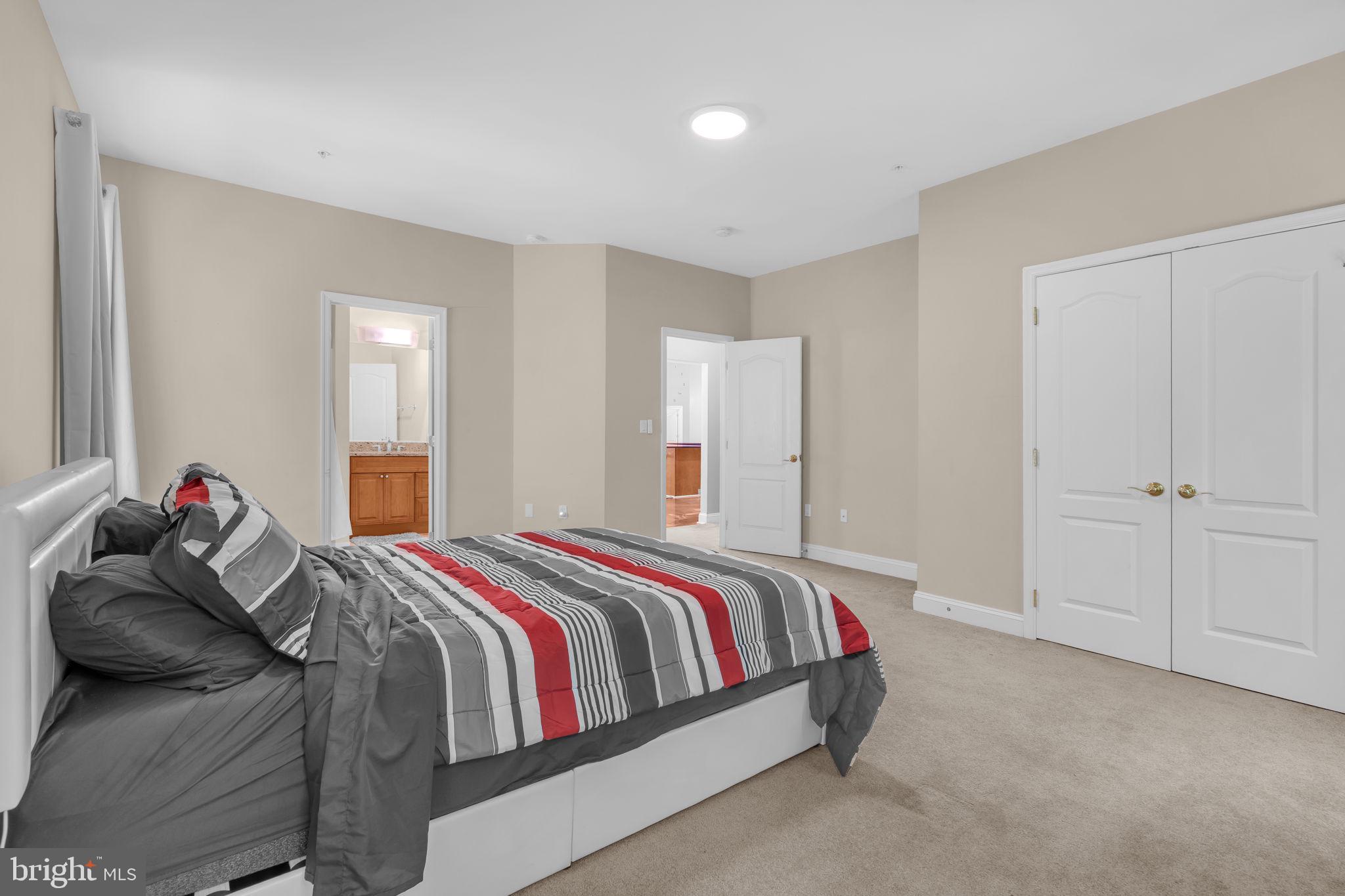 13716 Molly Berry Road Brandywine, MD 20613 - Photo 19 of 75 a bed room with a bed and a couch