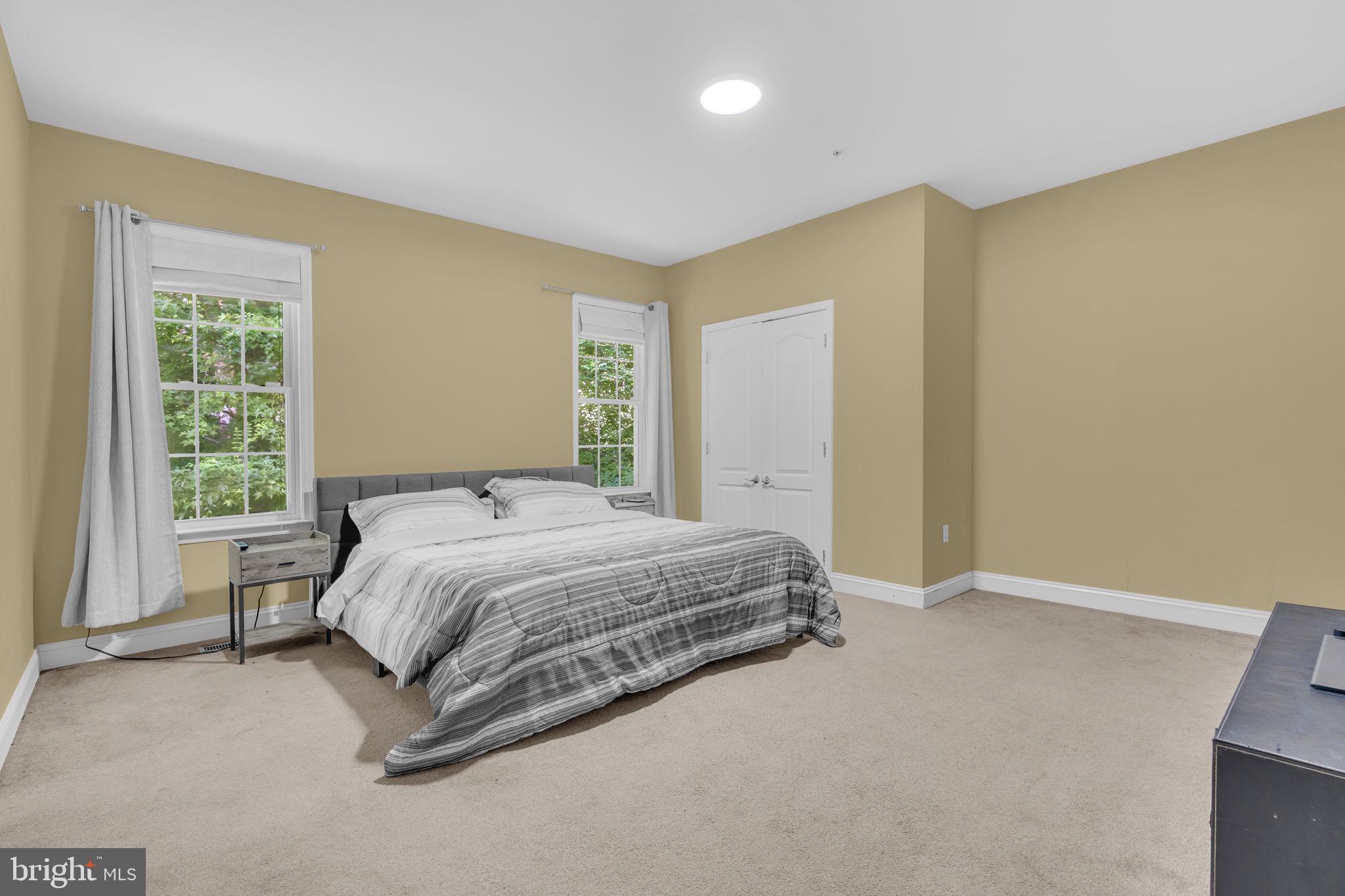 13716 Molly Berry Road Brandywine, MD 20613 - Photo 21 of 75 a spacious bedroom with a bed and a window