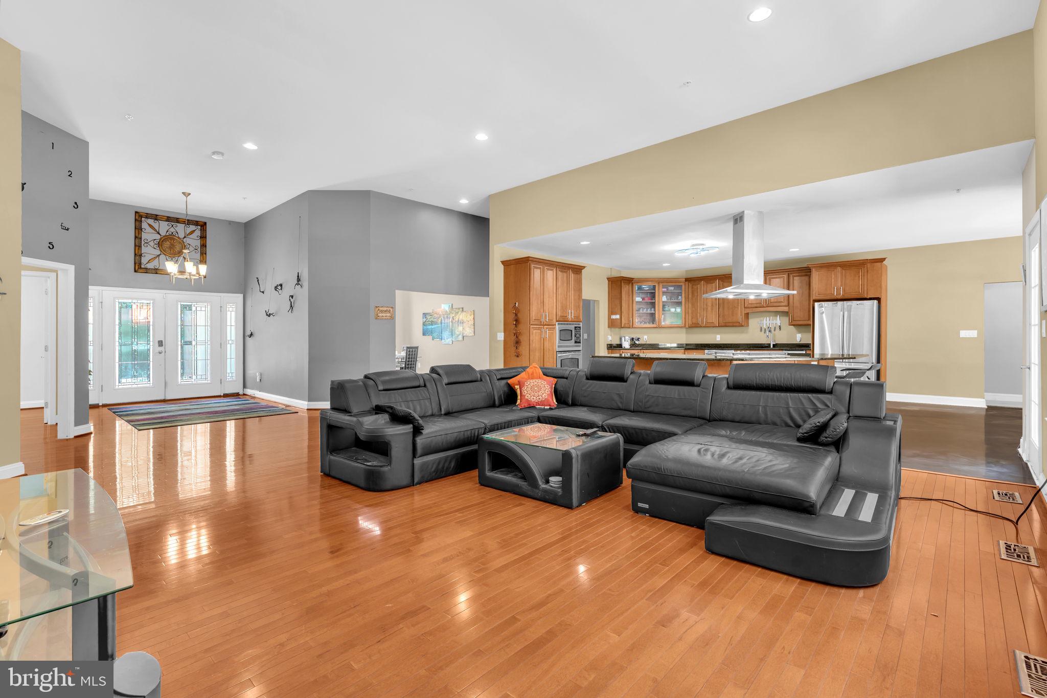 13716 Molly Berry Road Brandywine, MD 20613 - Photo 5 of 75 a living room with furniture and a large window
