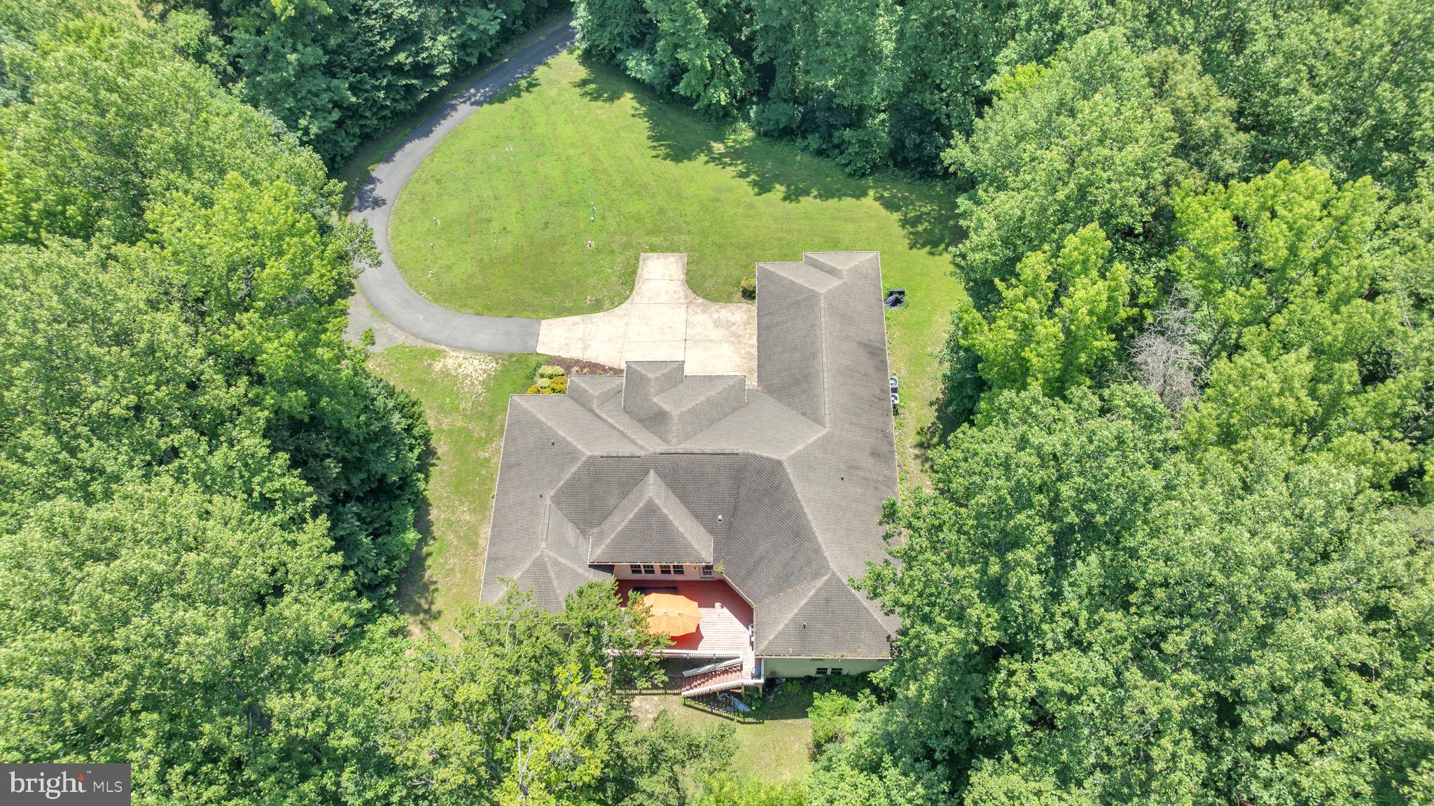 13716 Molly Berry Road Brandywine, MD 20613 - Photo 60 of 75 an aerial view of a house with outdoor space and trees all around