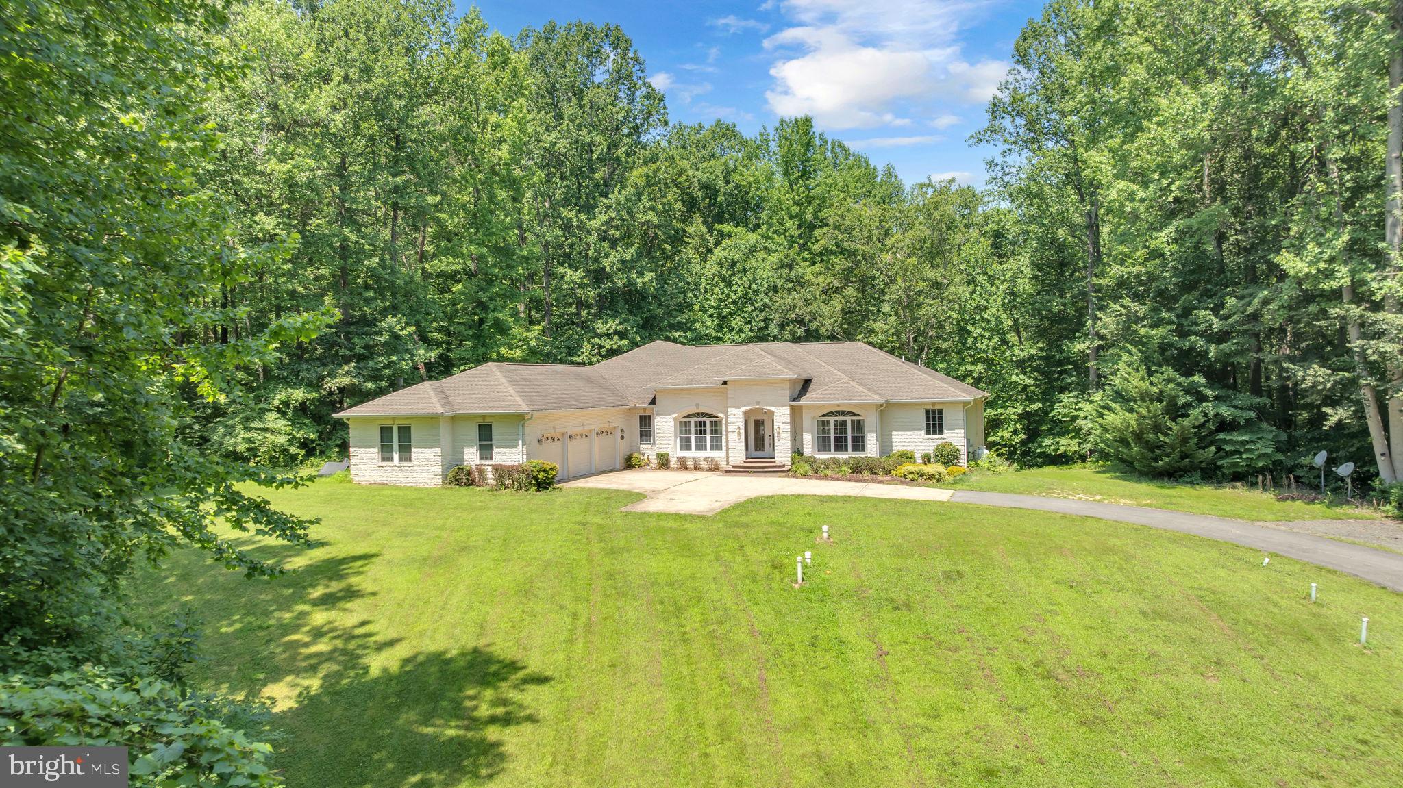13716 Molly Berry Road Brandywine, MD 20613 - Photo 65 of 75 a front view of a house with yard and green space