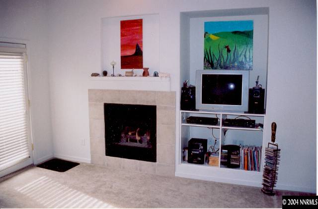 1610 Dutch Ravine Court Reno, NV 89521 - Photo 4 of 9 a living room with furniture and a fireplace