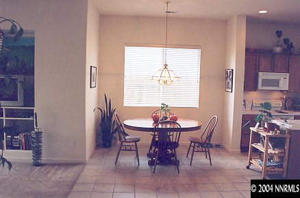 1610 Dutch Ravine Court Reno, NV 89521 - Photo 8 of 9 a view of a dining room with furniture and window