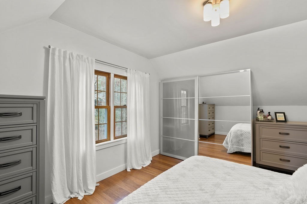 466 Rounseville Road Rochester, MA 02770 - Photo 18 of 38 a bedroom with a bed and with mirror