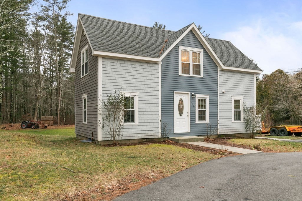 466 Rounseville Road Rochester, MA 02770 - Photo 27 of 38 a front view of a house with a yard