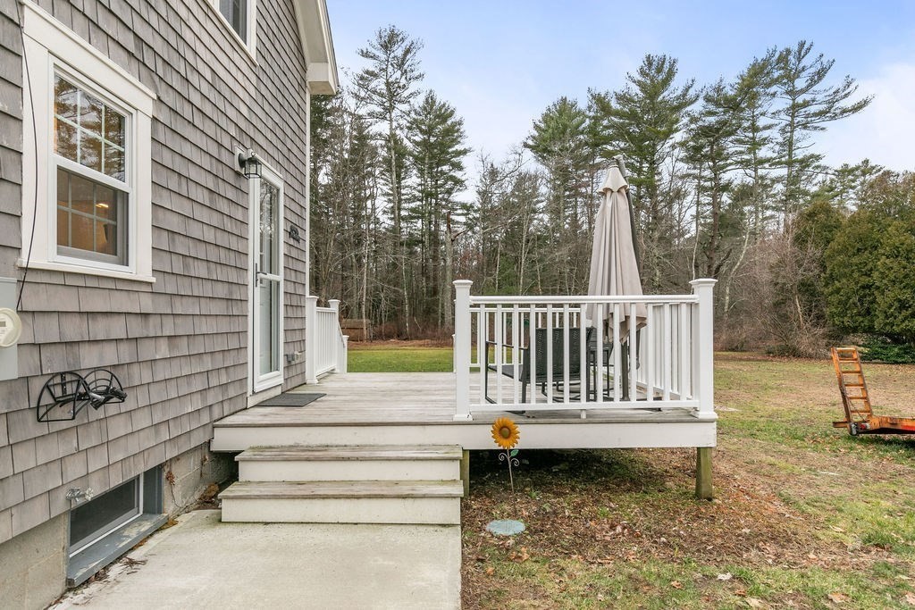 466 Rounseville Road Rochester, MA 02770 - Photo 29 of 38 a view of a chair and tables in the backyard of a house