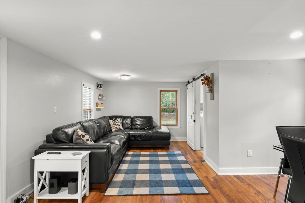 466 Rounseville Road Rochester, MA 02770 - Photo 3 of 38 a living room with furniture and a rug