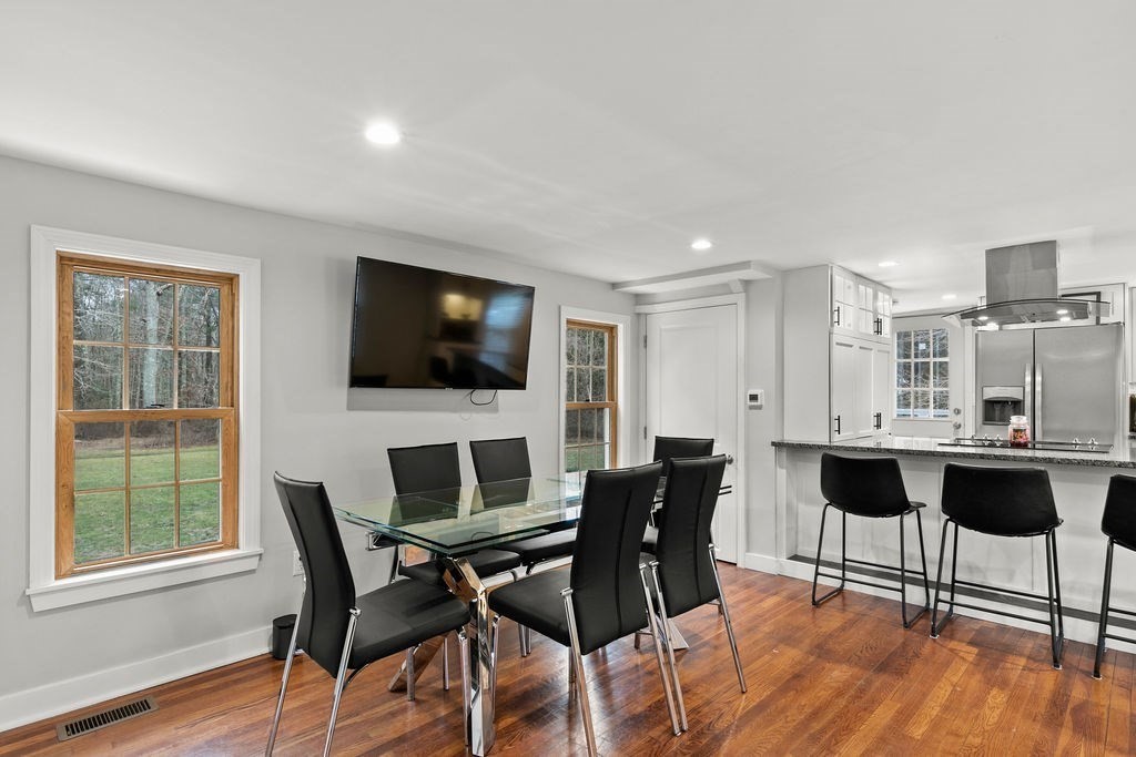 466 Rounseville Road Rochester, MA 02770 - Photo 6 of 38 a view of a dining room with furniture and wooden floor