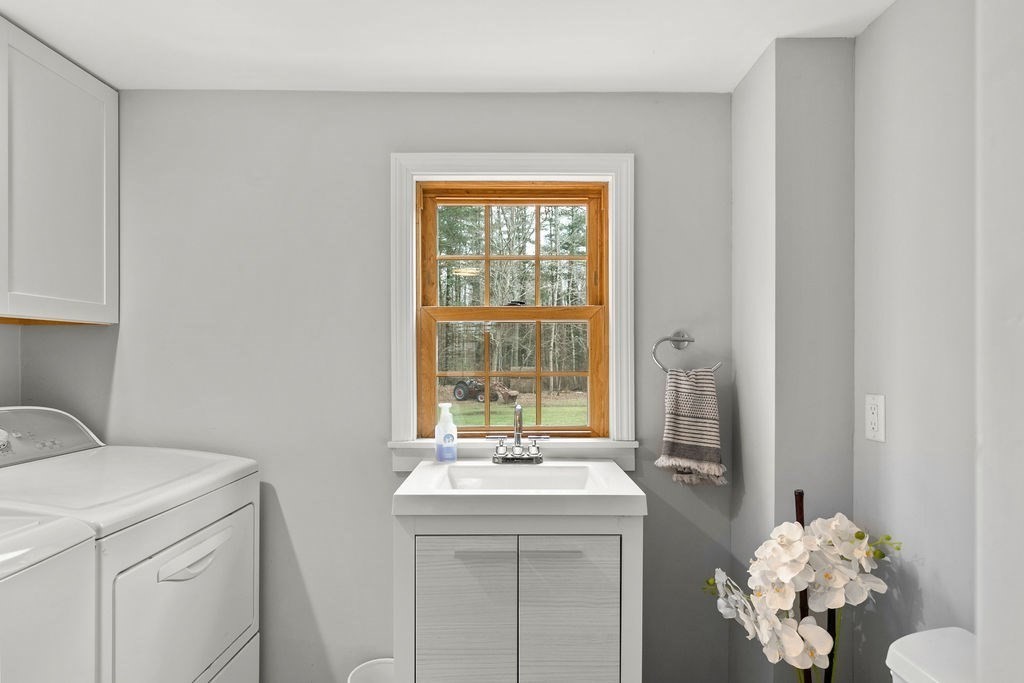 466 Rounseville Road Rochester, MA 02770 - Photo 8 of 38 a bathroom with a sink mirror and a window