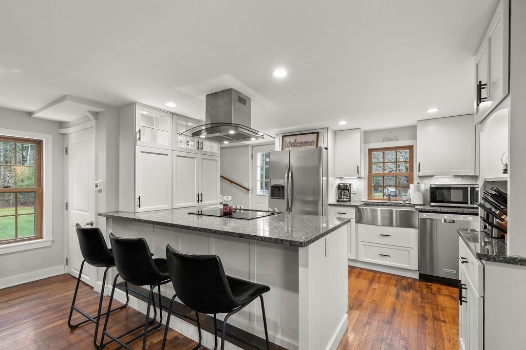 466 Rounseville Road Rochester, MA 02770 - Photo 9 of 38 a kitchen with stainless steel appliances kitchen island granite countertop a sink and cabinets