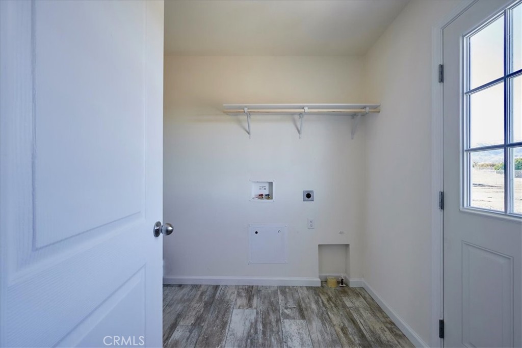 13369 Centola Road Phelan, CA 92371 - Photo 13 of 34 a view of a room with wooden floor closet and windows
