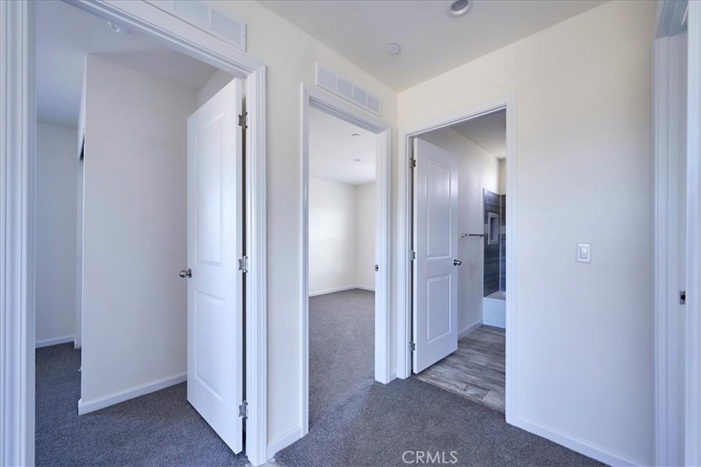 13369 Centola Road Phelan, CA 92371 - Photo 22 of 34 a view of a hallway with wooden floor
