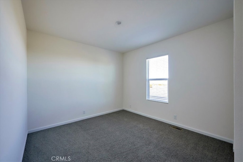 13369 Centola Road Phelan, CA 92371 - Photo 23 of 34 an empty room with a window