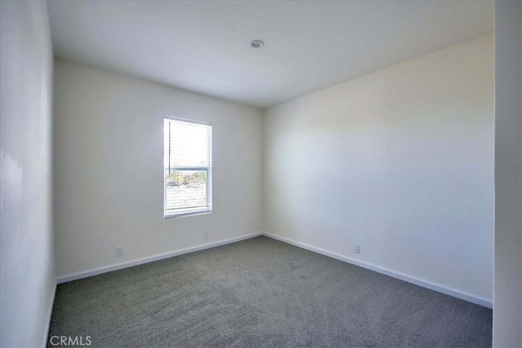 13369 Centola Road Phelan, CA 92371 - Photo 28 of 34 an empty room with a window