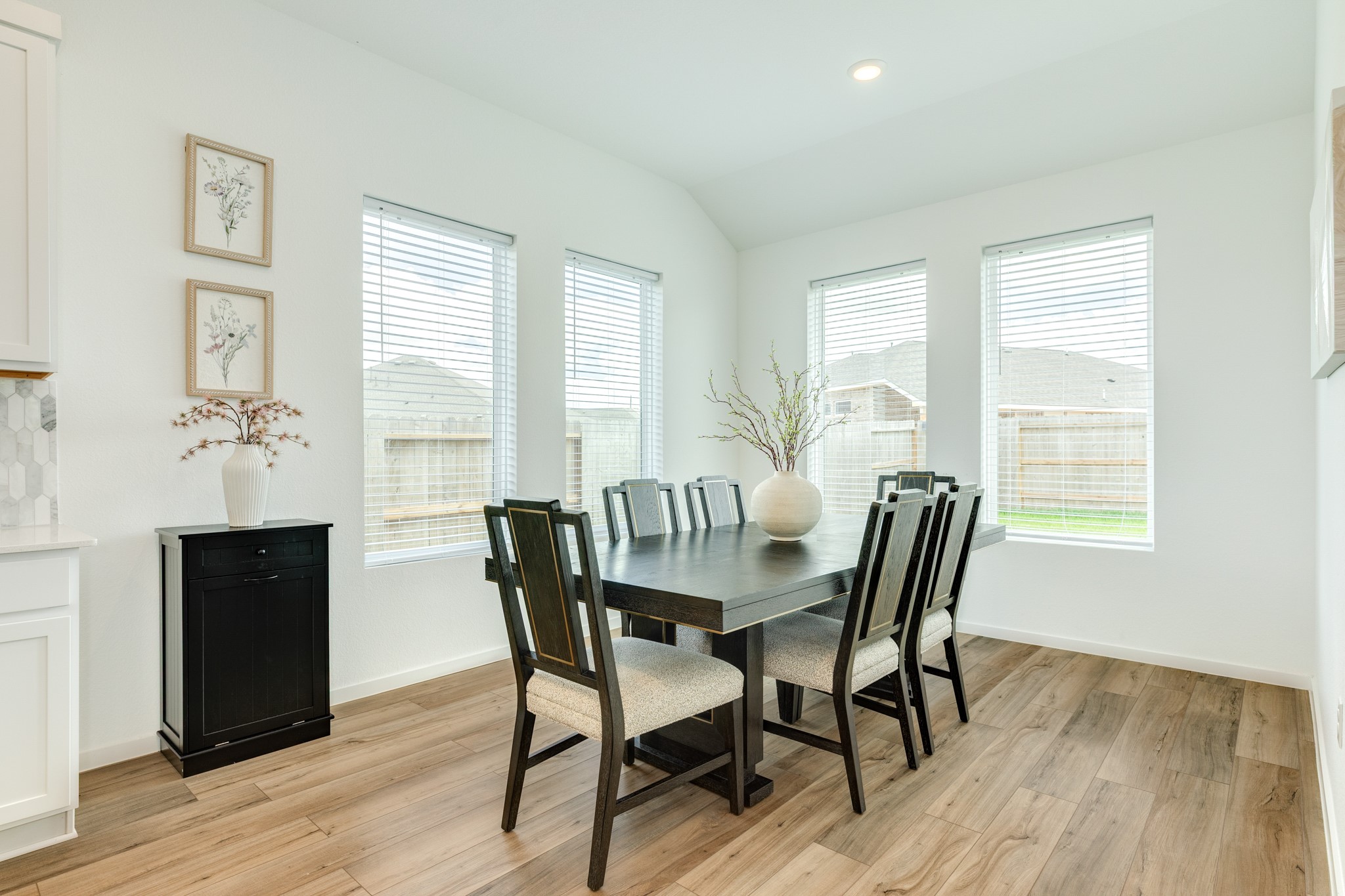 2618 Jasper Oaks Drive Rosharon, TX 77583 - Photo 17 of 43 The dining area features abundant natural light from oversized windows, offering beautiful views of the backyard.