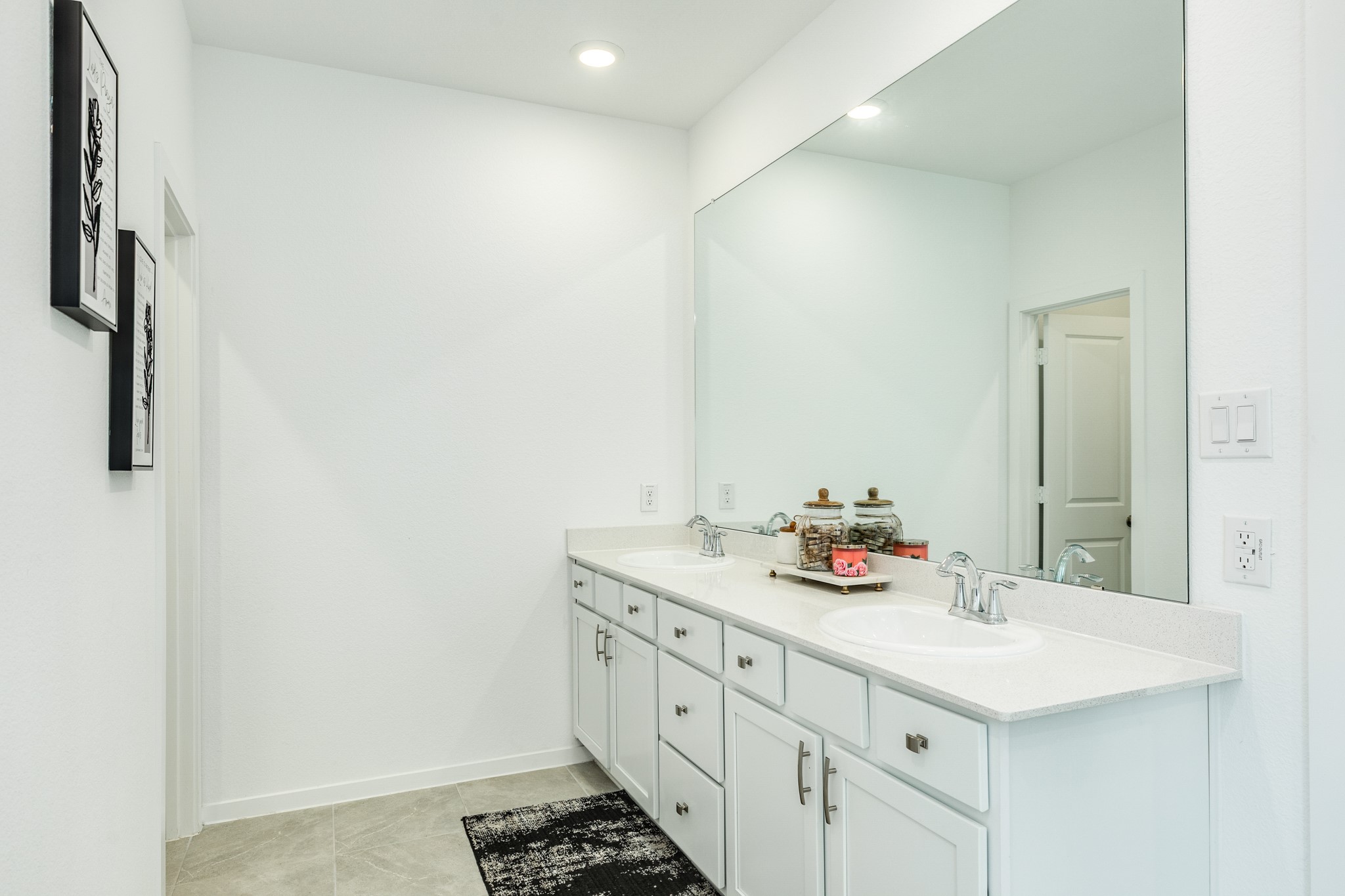 2618 Jasper Oaks Drive Rosharon, TX 77583 - Photo 21 of 43 Primary bathroom features double vanities, quartz countertops, an oversized mirror, recessed lighting, and tile flooring.