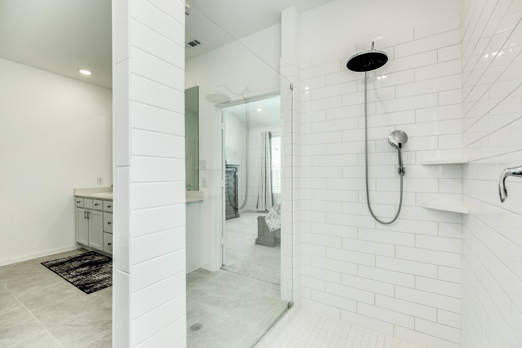 2618 Jasper Oaks Drive Rosharon, TX 77583 - Photo 23 of 43 Beautiful tile lines the shower, complete with glass doors and a rain head.