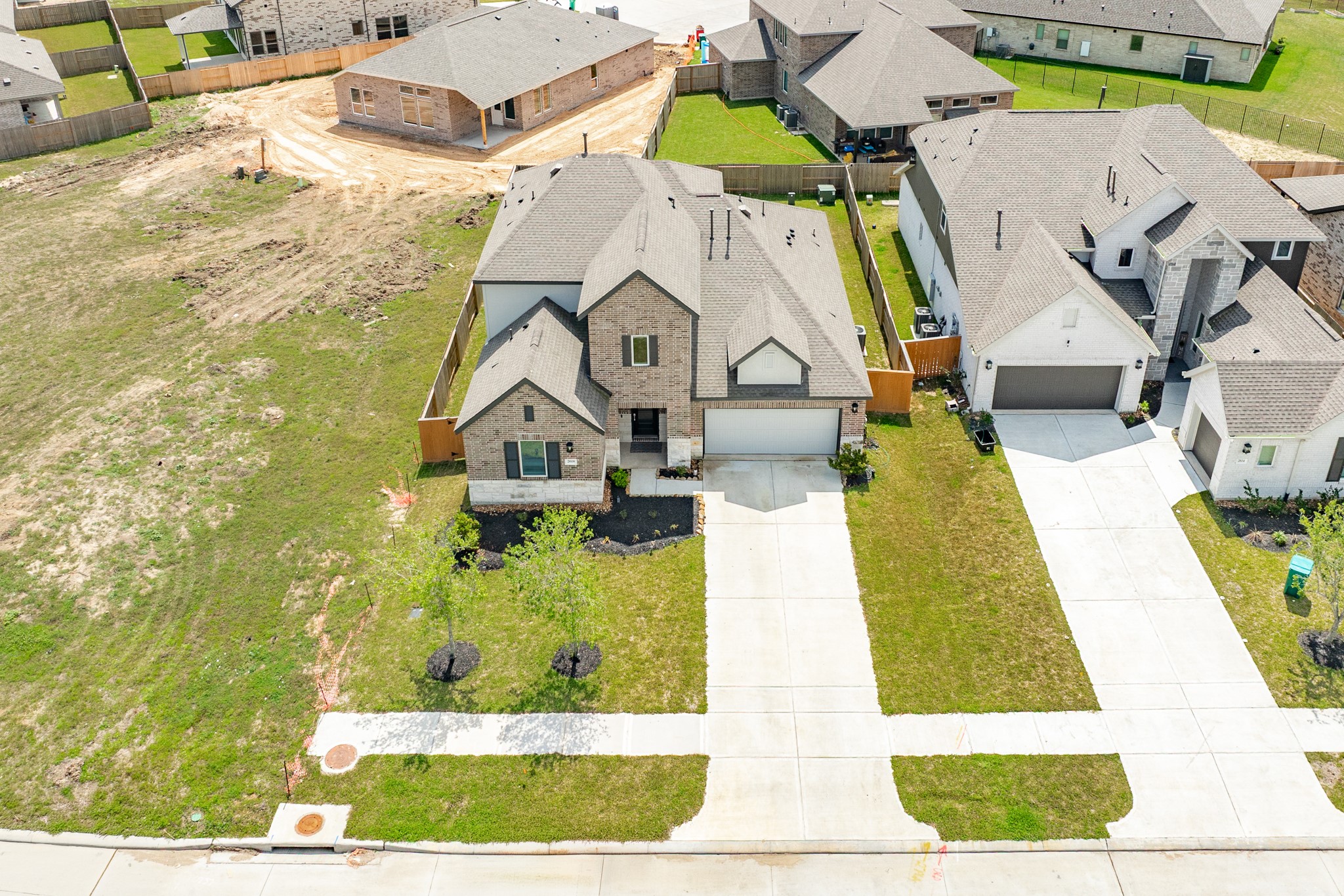 2618 Jasper Oaks Drive Rosharon, TX 77583 - Photo 38 of 43 Exterior shot capturing the home's place in the neighborhood, highlighting the surrounding properties and neighboring houses.