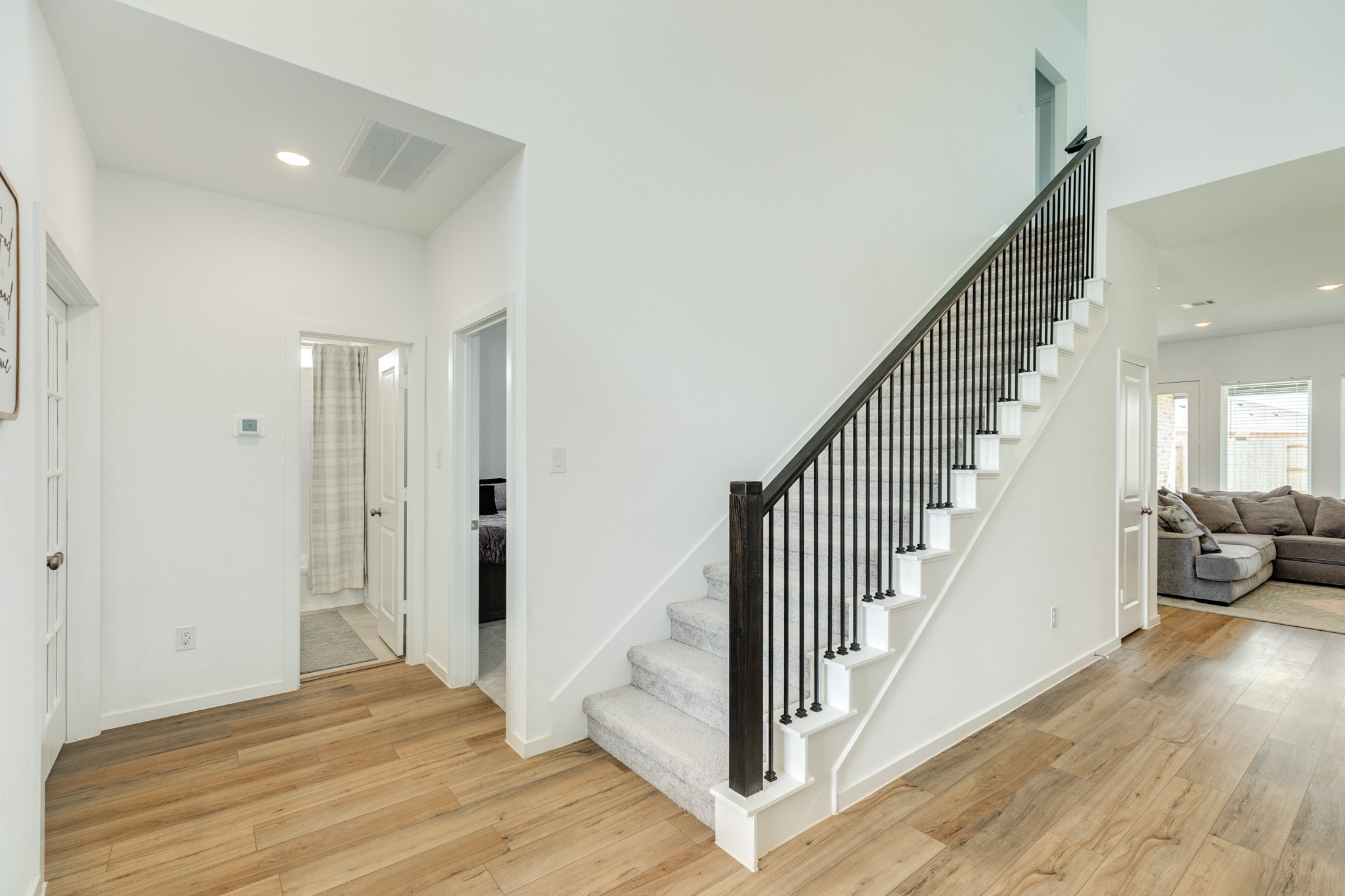 2618 Jasper Oaks Drive Rosharon, TX 77583 - Photo 5 of 43 This view captures the staircase, guest suite and bath, office with double doors, and the family room, which is visible just beyond the staircase.
