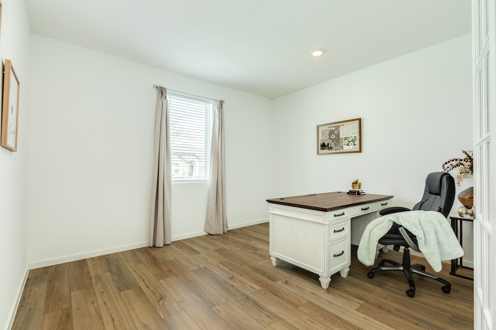 2618 Jasper Oaks Drive Rosharon, TX 77583 - Photo 7 of 43 This view showcases the beautiful floors and ample space, perfect for a work-from-home office.