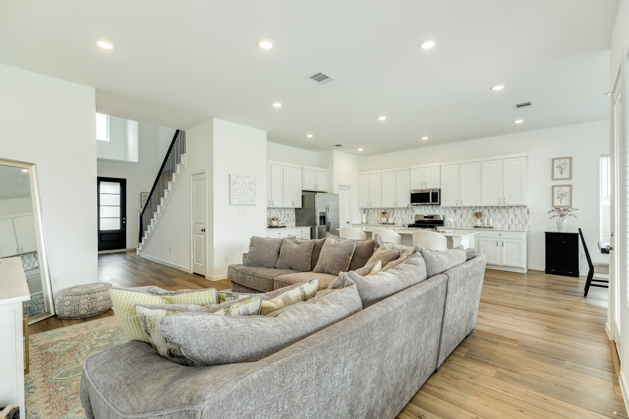 2618 Jasper Oaks Drive Rosharon, TX 77583 - Photo 43 of 43 This home boasts an open floor plan, allowing for a seamless transition from the front door to the family room, kitchen, and dining area, creating an excellent space for entertaining.