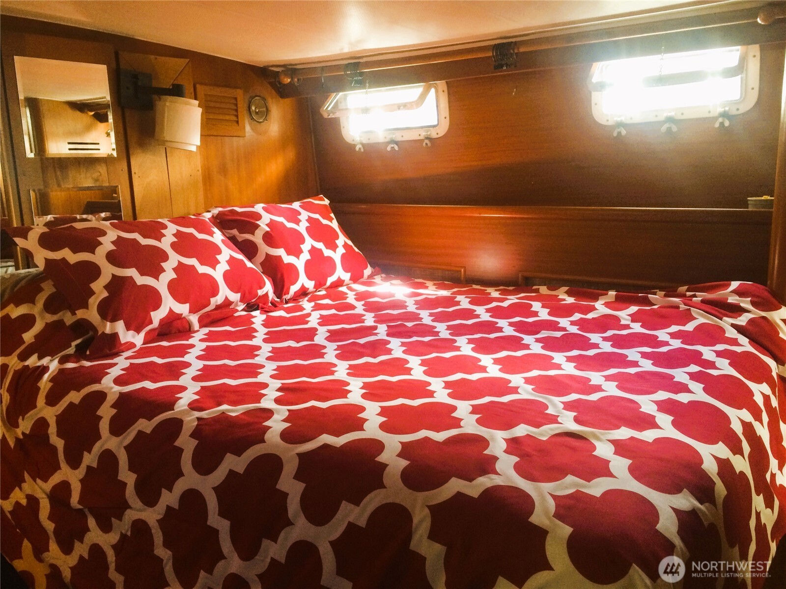 2040 Westlake Avenue North, Unit 10 Seattle, WA 98109 - Photo 13 of 14 a bedroom with a bed and a painting on the wall