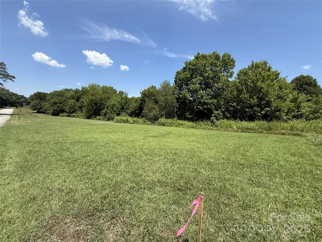 a view of a field with an outdoor space