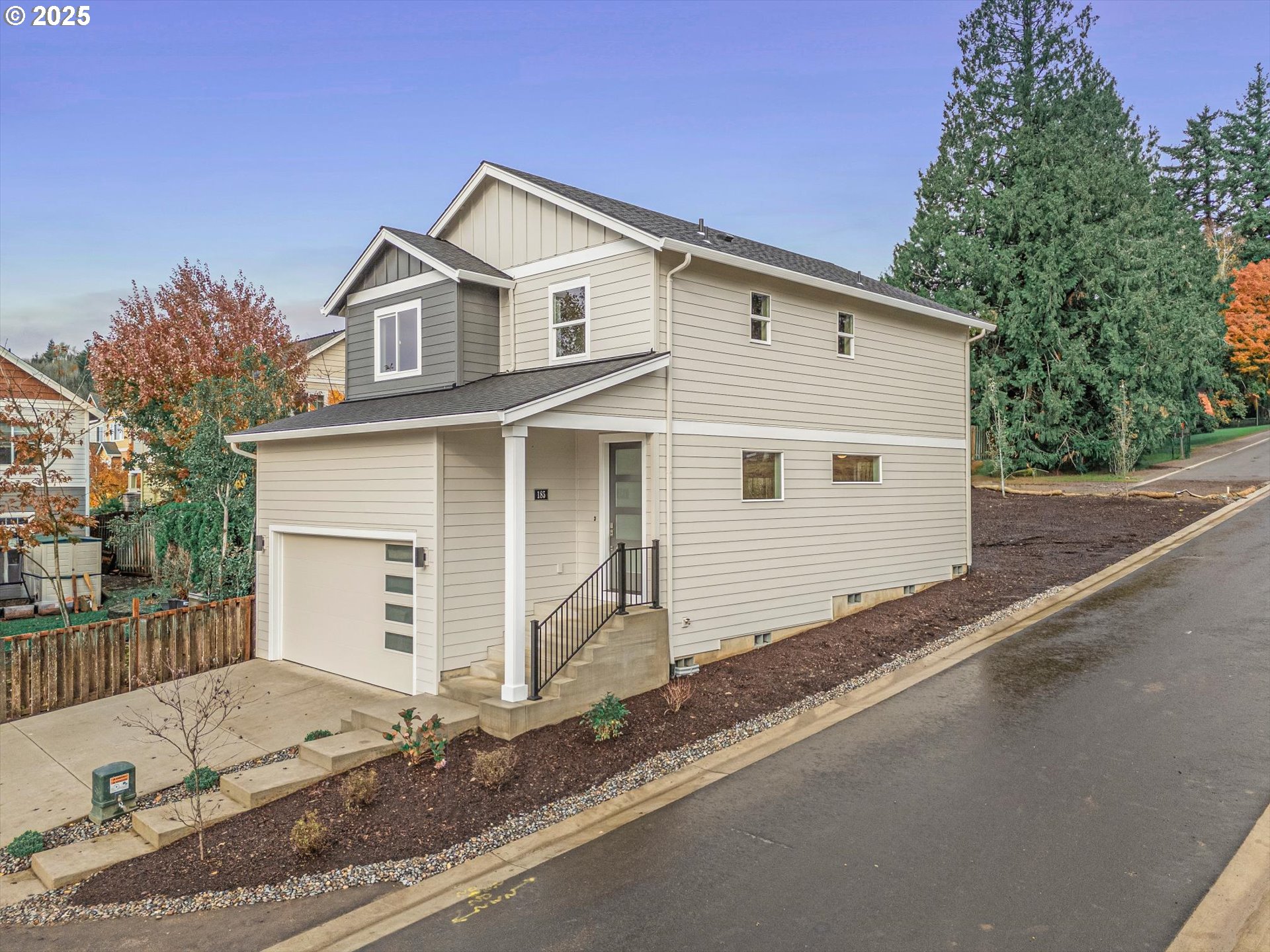 185 Southwest Mawrcrest Avenue Gresham, OR 97030 - Photo 1 of 46 a view of a white house with a large space and city view