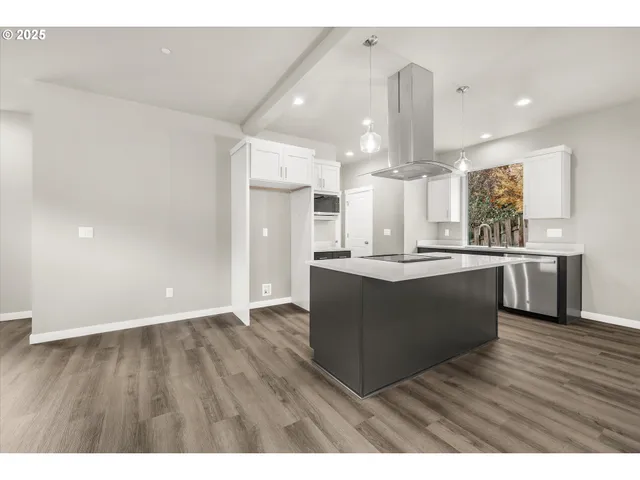 a view of kitchen with wooden floor