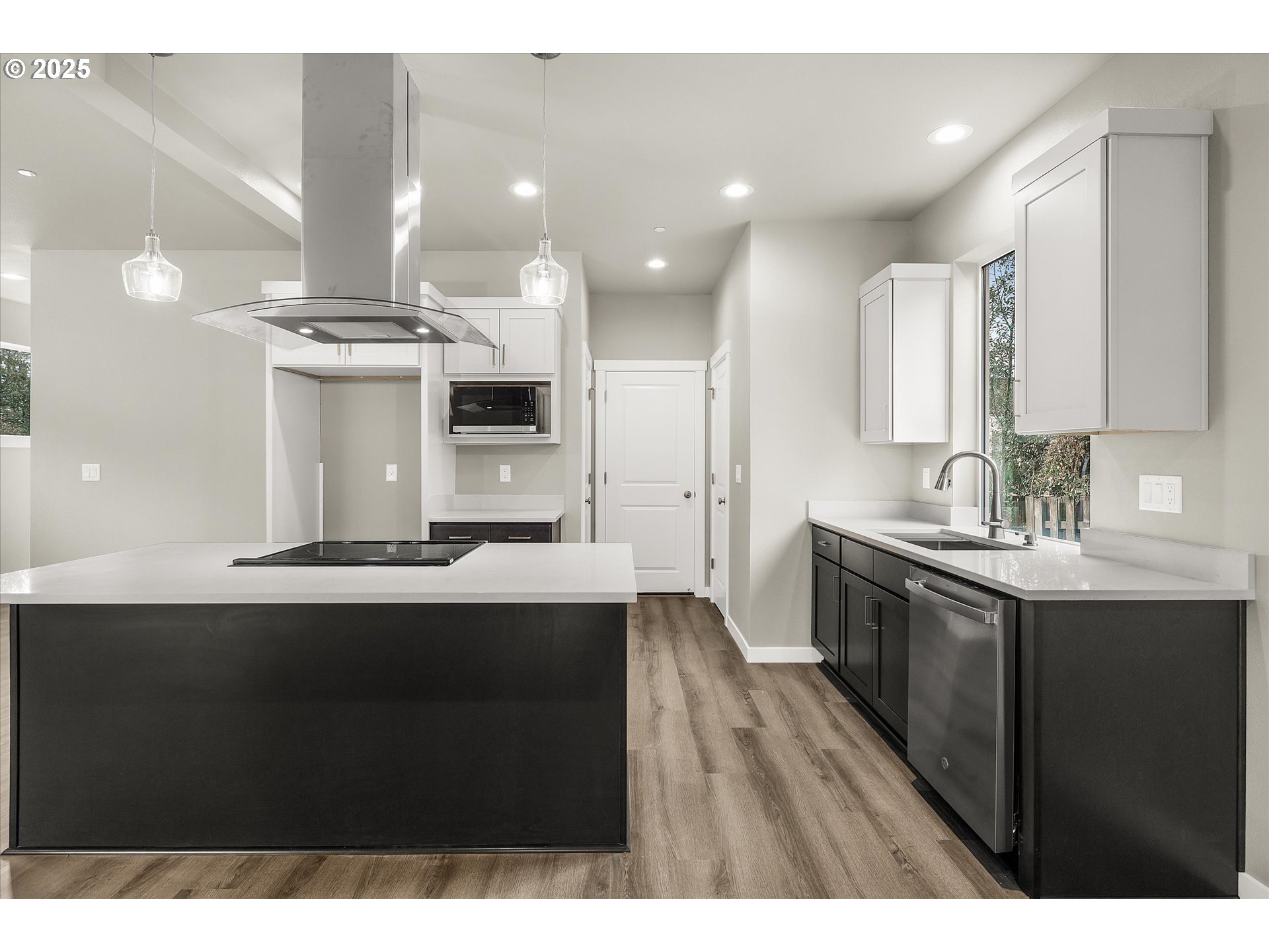 185 Southwest Mawrcrest Avenue Gresham, OR 97030 - Photo 13 of 46 a kitchen with kitchen island a sink appliances and cabinets