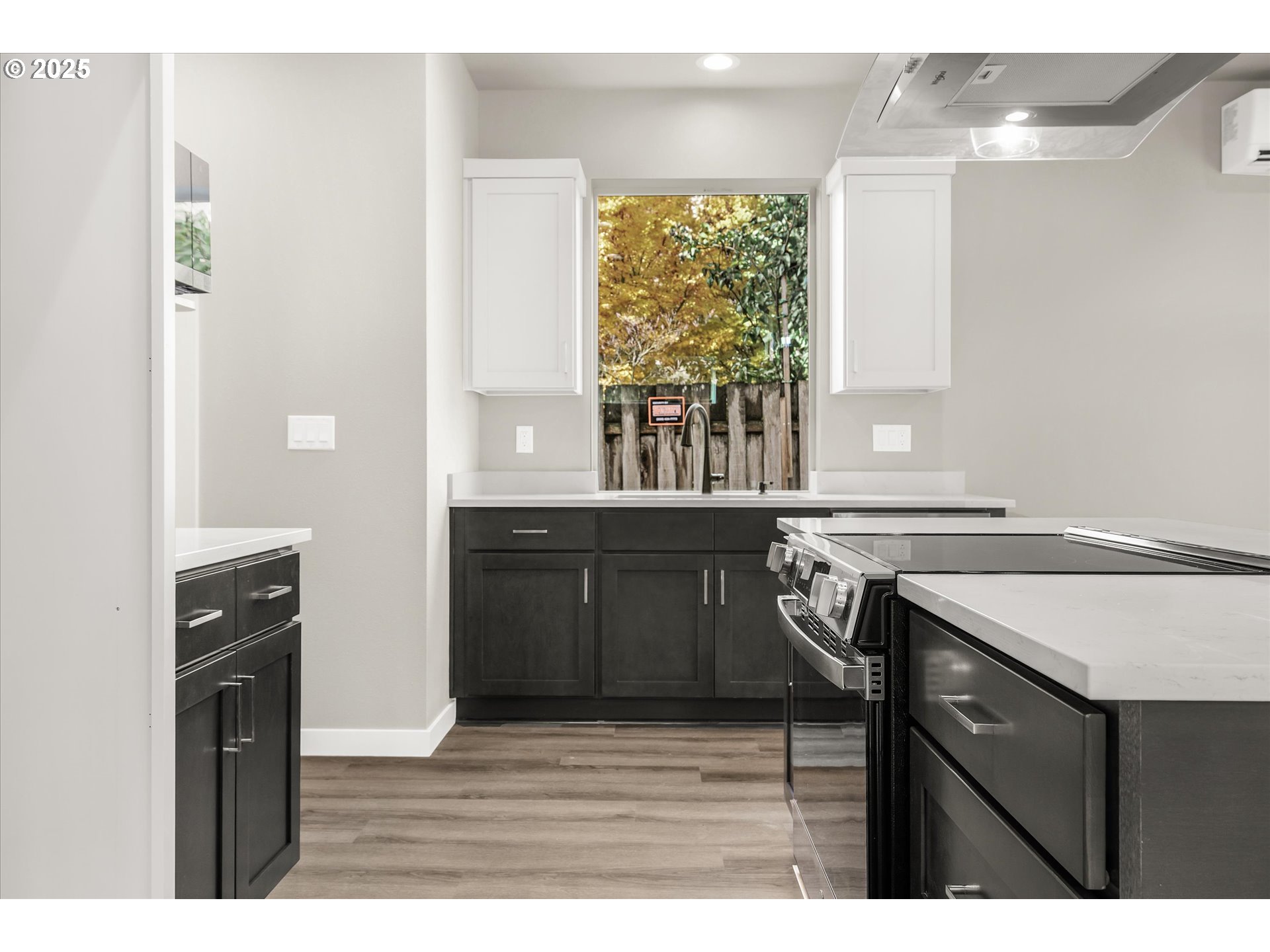 185 Southwest Mawrcrest Avenue Gresham, OR 97030 - Photo 14 of 46 a kitchen with a sink a window and cabinets