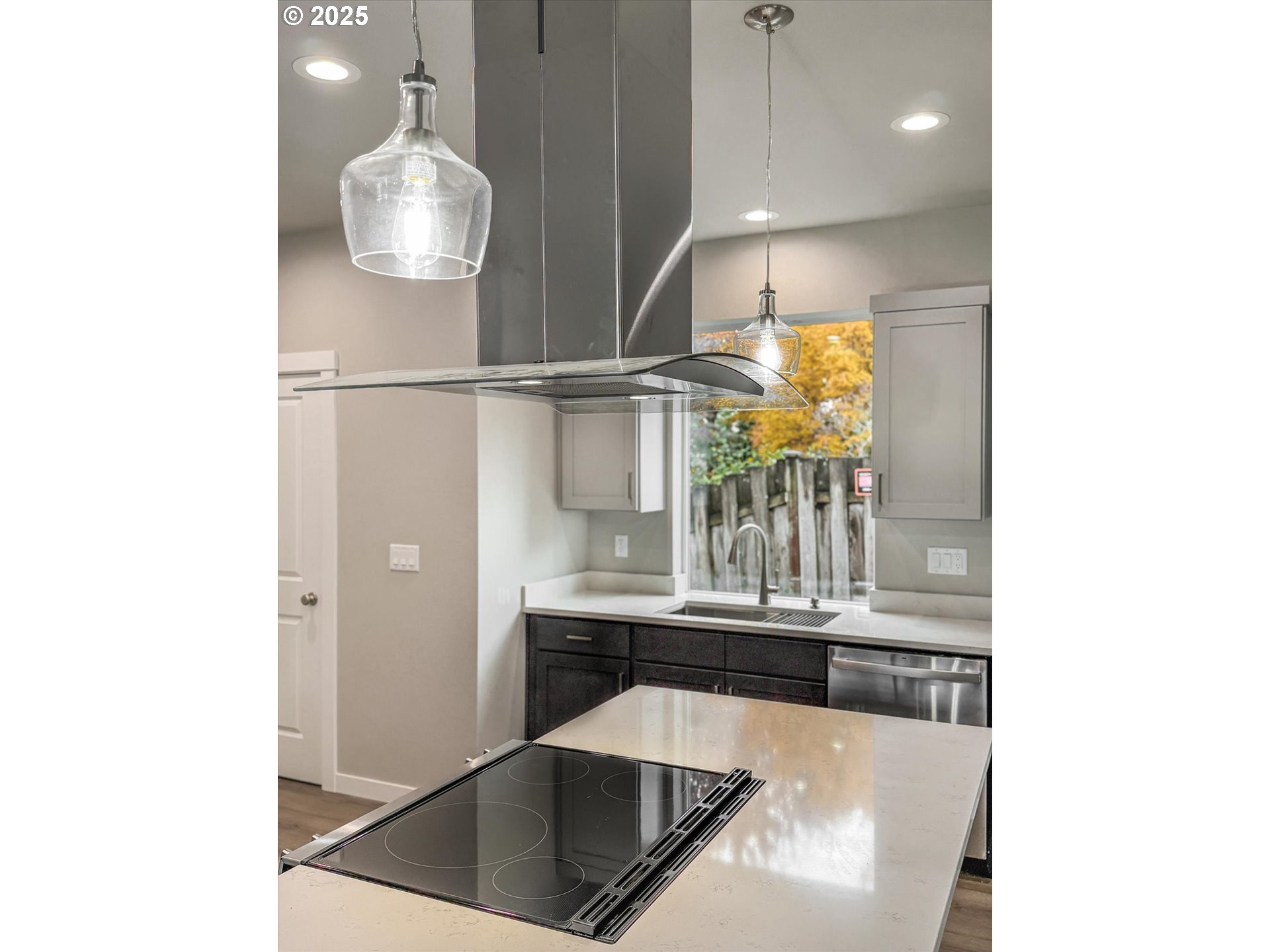 185 Southwest Mawrcrest Avenue Gresham, OR 97030 - Photo 15 of 46 a kitchen with a sink and chandelier
