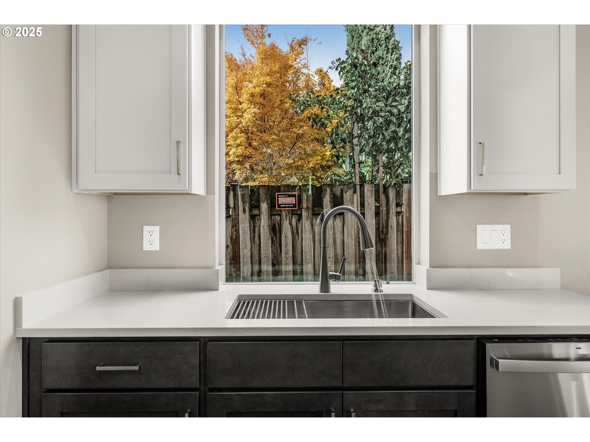 185 Southwest Mawrcrest Avenue Gresham, OR 97030 - Photo 16 of 46 a kitchen with a sink and cabinets